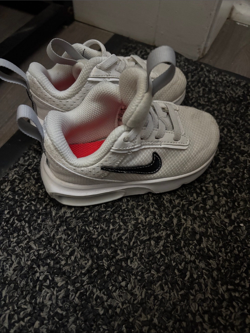 Nike Kids White Sneakers with Black Swoosh and Red Insole